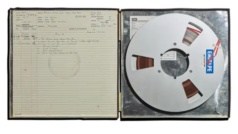 PA Media A photo of a large 1960s audio tape with a cardboard cover. 