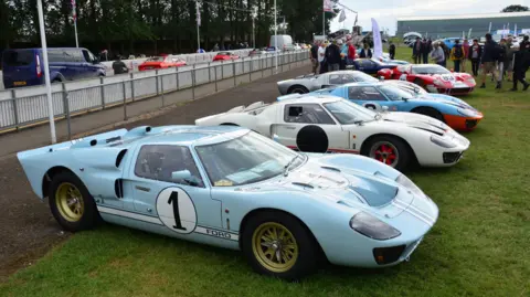 SLOUGH MUSEUM A row of Ford GT40s at a car show.