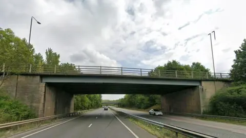 Google A bridge over a duel-carriageway. 