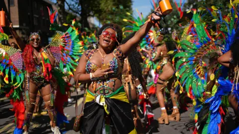 Pa Female Group media in a bright costume on the road. A woman in the future looks like to sing. 