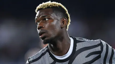 Paul Pogba wearing a Juventus shirt