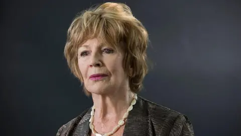 Getty Images Headshot of Edna O'Brien against a grey background