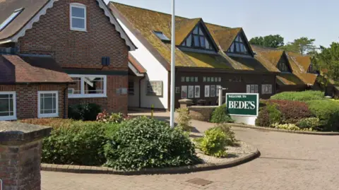 Google Maps Street view images of houses with small hedges in front of them