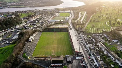 Getty An aerial shot of the Find Insurance Celtic Park and The Ryan McBride Brandywell Stadium. The two pitches are near the River Foyle and a large cemetery. 
