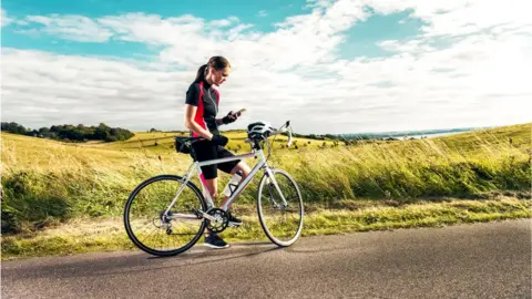 Getty Images Woman with mobile phone