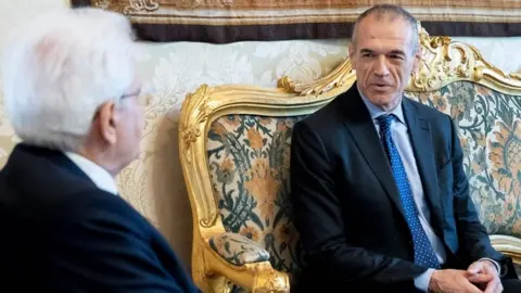 AFP Carlo Cottarelli (left) meets Italian President Sergio Mattarella