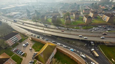 Redbridge flyover aerial image shows a large dual carriageway snaking above a large roundabout.