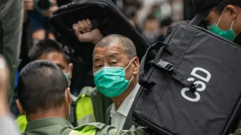 Getty Images Jimmy Lai, Apple Daily founder, arrives at the Court of Final Appeal ahead a bail hearing on February 9, 2021 in Hong Kong.