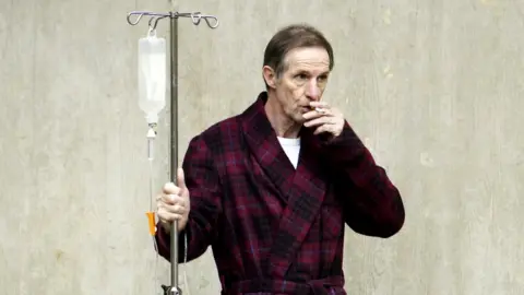 Getty Images Patient smoking outside a hospital