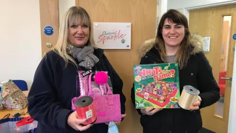 Gill Harrison Volunteers with gifts