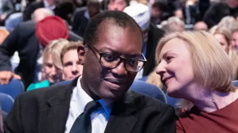 PA Media Kwasi Kwarteng, pictured with Liz Truss