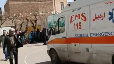 An ambulance arriving at a school in Ardabil, north-western Iran