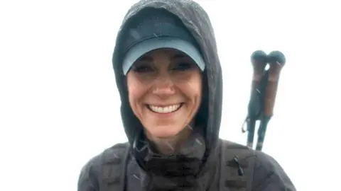 Katherine Princess of Wales stands at the top of Ben Nevis smiling