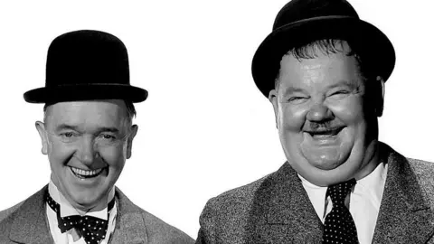 Stan laurel (Left) and Oliver Hardy pose for a portrait circa 1935 in Los Angeles, California