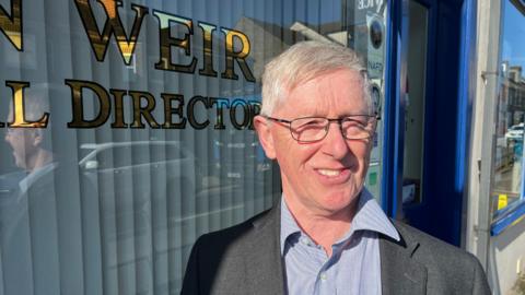 Funeral director John Weir outside his business in High Street