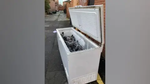 Darlington Borough Council Dumped freezer with lid open showing dead pigeons
