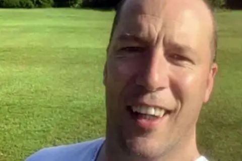 PACEMAKER Barry Noone is standing in a field. He's smiling at the camera. 