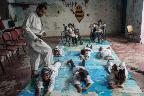 Anas Alkharboutli Children in a karate lesson