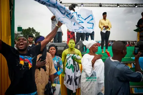 AFP A man who painted his body in yellow in Bamako on August 10, 2018
