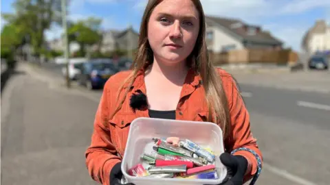 BBC Laura Young has been collecting vapes on daily dog walks