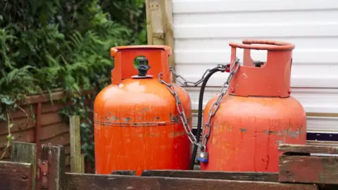 Getty Images Calor gas cylinder bottles at caravan park site UK - Stock photo
