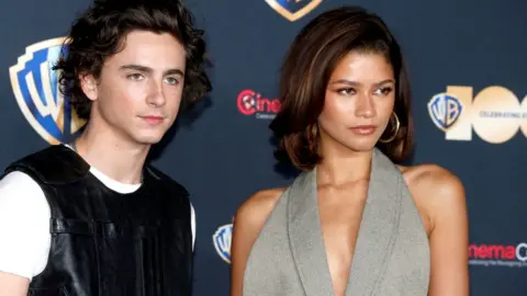 Reuters Actors Timothee Chalamet and Zendaya posing for photos