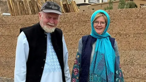 Peter and Barbie Reynolds stand together prior to their detention 