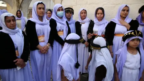 EPA Yazidis don special clothing for the ceremony to appoint their new spiritual leader