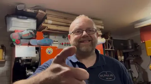 Supplied A man with a toe thumb giving a thumbs-up to the camera