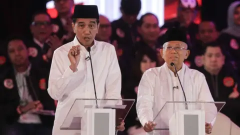 Getty Images presidential and vice presidential candidate number 01 Joko Widodo (L) and Ma'ruf Amin (R)