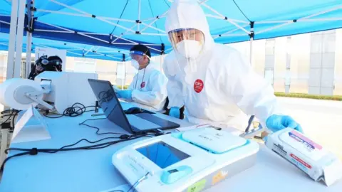 EPA Election booth with staff in PPE