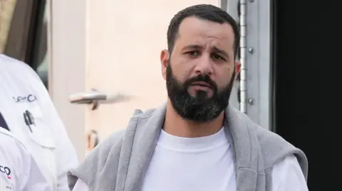 Eddie Mitchell Anas Al Mustafa arriving at Lewes Crown Court