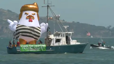 CBS An inflatable chicken mocks Donald Trump