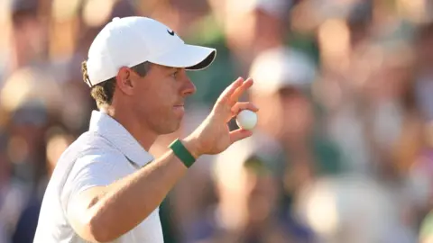 Rory McIlroy waves to the Masters crowd