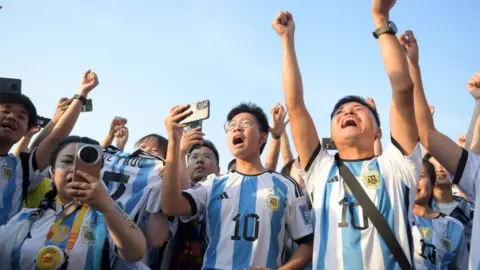 Getty Images Chinese fans of Argentina cheer prior to the international friendly match between Argentina and Australia at Workers Stadium on June 15, 2023 in Beijing, China.