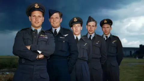 Getty Images/IWM A line up of RAF service personnel, including Guy Gibson and other members of the 617 Squadron. 