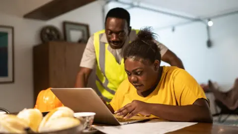 Stock image of a family doing home finances