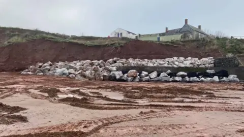 Cara Strom  Rocks on the beach at Blue Anchor Bay in Somerset