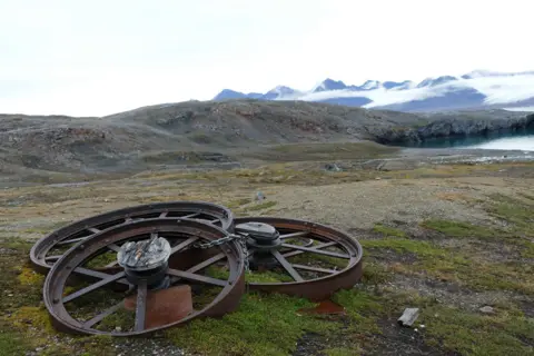 Emma Warren Abandoned wheels at the site of former mining settlement in the Svalbard archipelago's Arctic island of Blomstrandøya