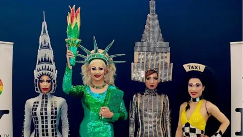 Alexander Heimberg Screaming Queens drag performers dressed as the New York skyline