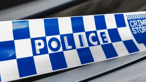 A blue and white checked police tape 