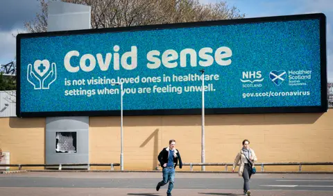 PA Media Covid sign in Scotland