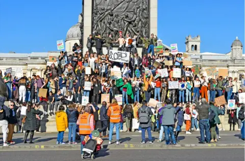 Alamy Protesters gather on the steps of Nelson's Column in Trafalgar Square