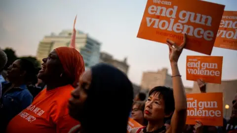 Reuters People hold a vigil to remember victims of the mass shootings at Dayton and El Paso, at Grand Army Plaza in Brooklyn, New York, August 5, 201