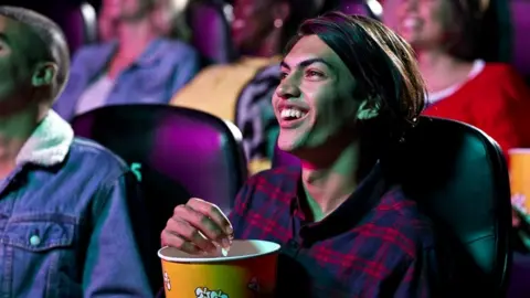 Getty Images young man in cinema