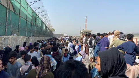 Reuters General view of the crowds of people near the airport in Kabul,