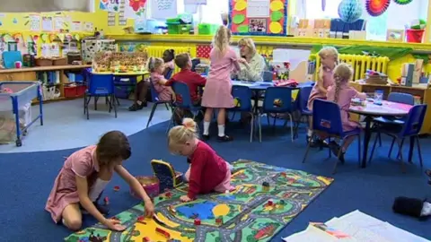 Children playing in a classroom