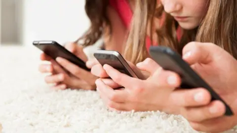 Thinkstock Children texting