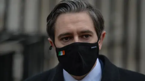 Getty Images/NurPhoto Simon Harris wearing Covid mask