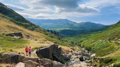 PA Media Walkers enjoyed the sunnier weather on Mount Snowdon in Gwynedd on Saturday